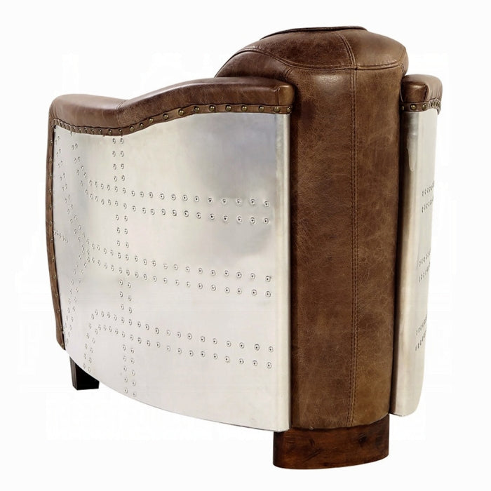 white background leather chair with arms brown leather matching through out aluminum siding wrapping the outer part of the arms leather pinned stitching stripped going down the middle and wooden square feet pegs the back middle does not have the aluminum siding 