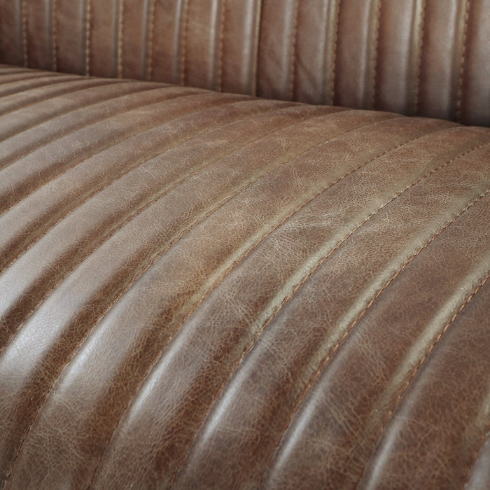 leather grain medium brown leather striped doing up and down straight stitching 