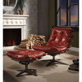 Red leather chair and ottoman in a living room with a fireplace and window.