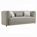 Gray sofa with patterned cushions on a white background