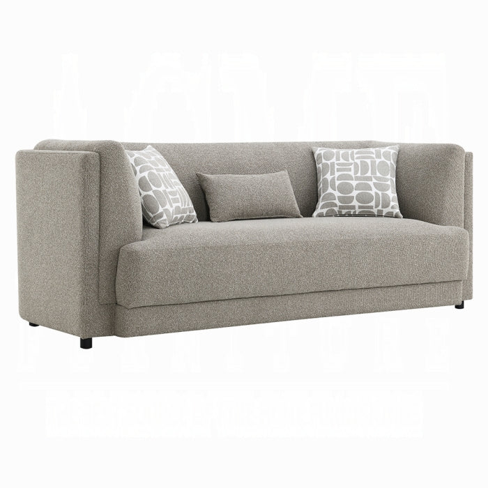 Gray sofa with patterned cushions on a white background