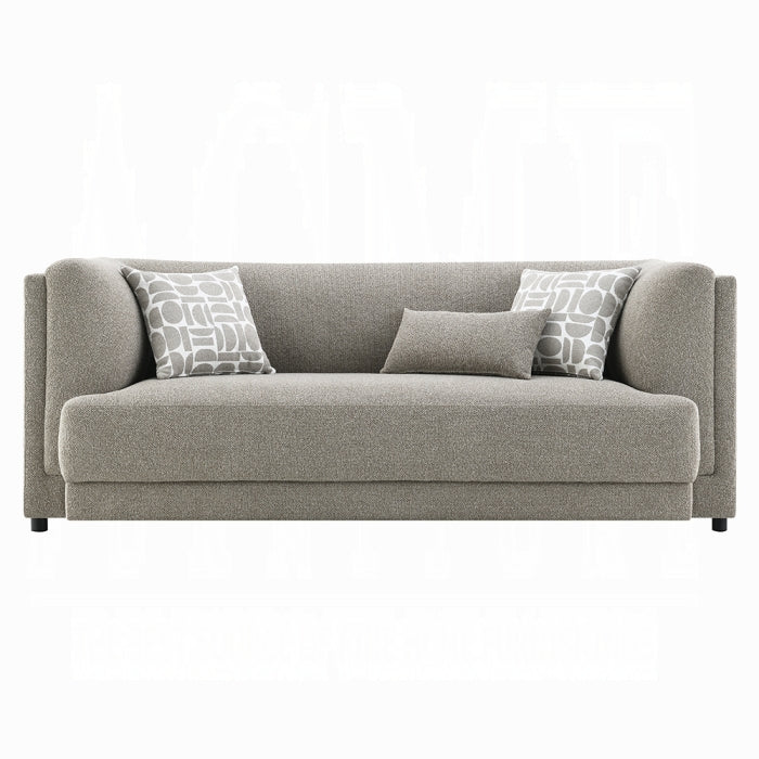Gray sofa with patterned cushions on a white background