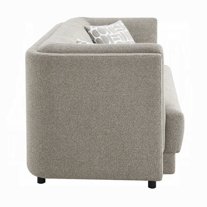 Gray fabric sofa with a pillow on a white background side profile 