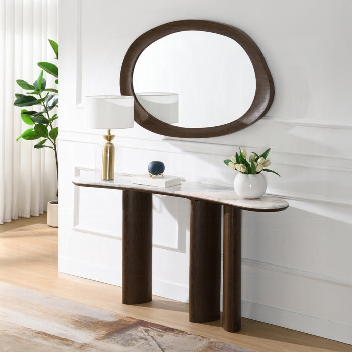 Console table with decorative items against a white wall