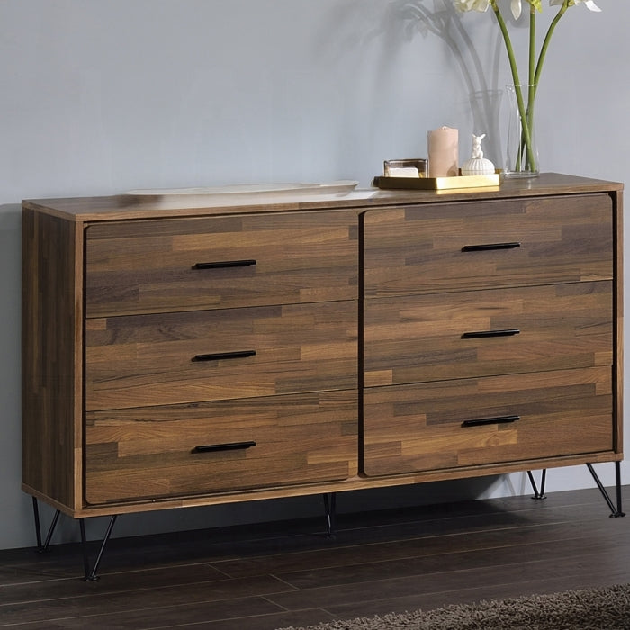Wooden dresser with four drawers in a room setting