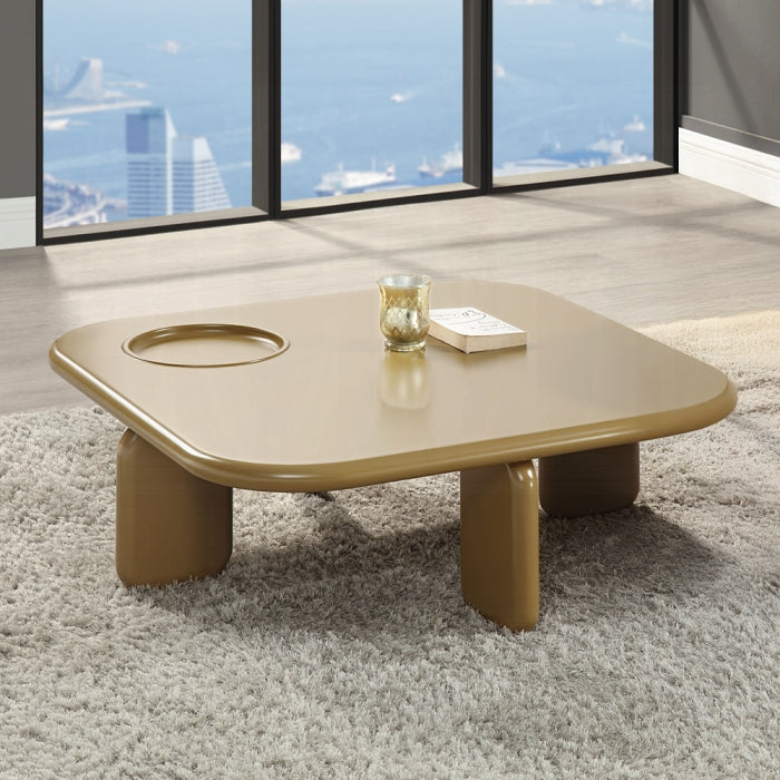 white background yellowish brown rounded edges and rounded legs every shape top and legs is almost a rectangle without the sharp edges 4 legs and the top of the table has a circle indent to place something in without it sliding away staged indoors with a rug and window and cups with a book ontop 