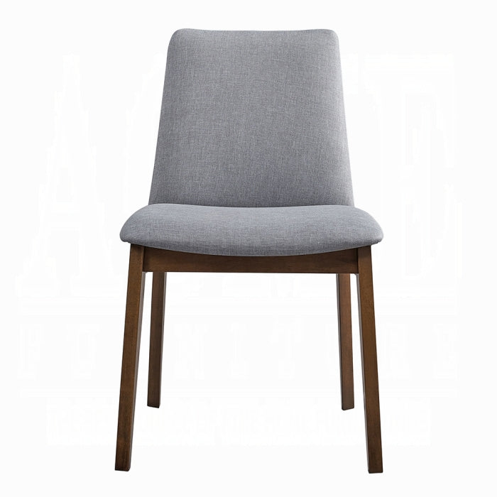 grey fabric dinning chair with no arms and wood leg base four legs white background