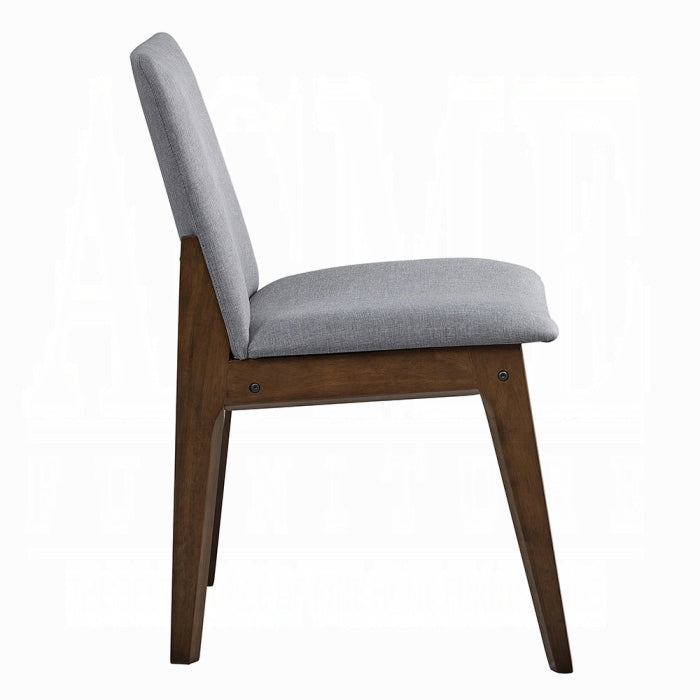 grey fabric dinning chair with no arms and wood leg base four legs white background