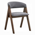 white background chair with grey fabric padding and matching grey fabric padding as a backrest that is slightly curved leaving an open middle portion frame is wooden medium brown with a triangle shape 
