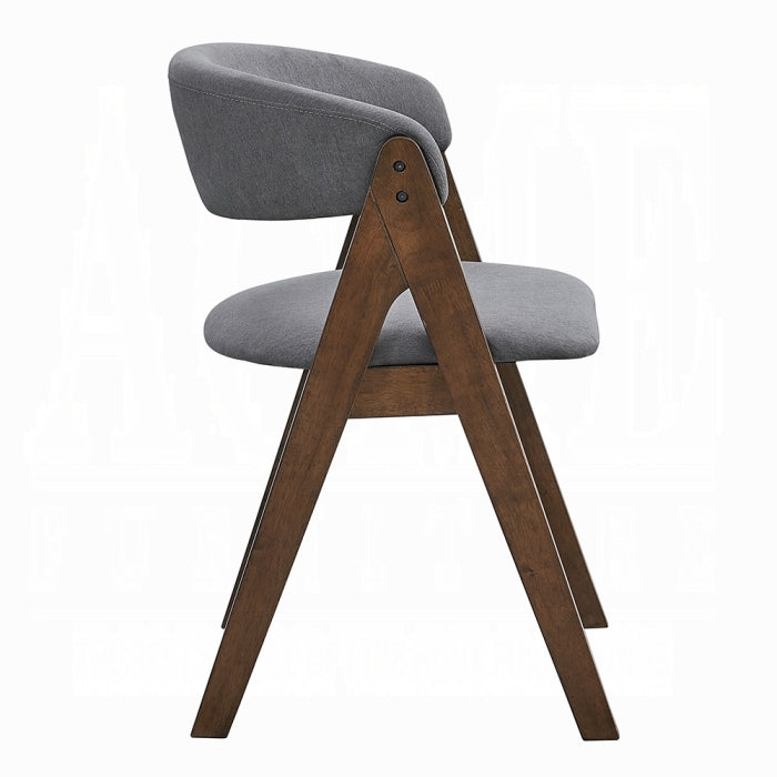 white background chair with grey fabric padding and matching grey fabric padding as a backrest that is slightly curved leaving an open middle portion frame is wooden medium brown with a triangle shape 