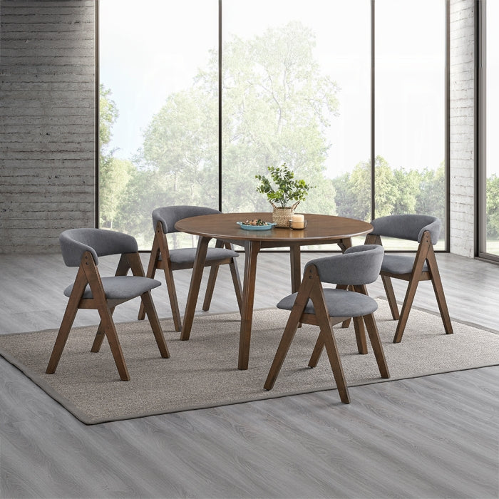 dinning room setting staged to show the chairs triangle legs wooden frame grey fabric with an open middle back and grey padded seating with rugs plants chirs all around a table wooden 