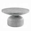 hour glass shape concrete appearance coffee table with ridged lines at the bottom and a round flat top white background