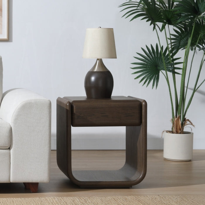 Wooden side table with a lamp in a living room setting