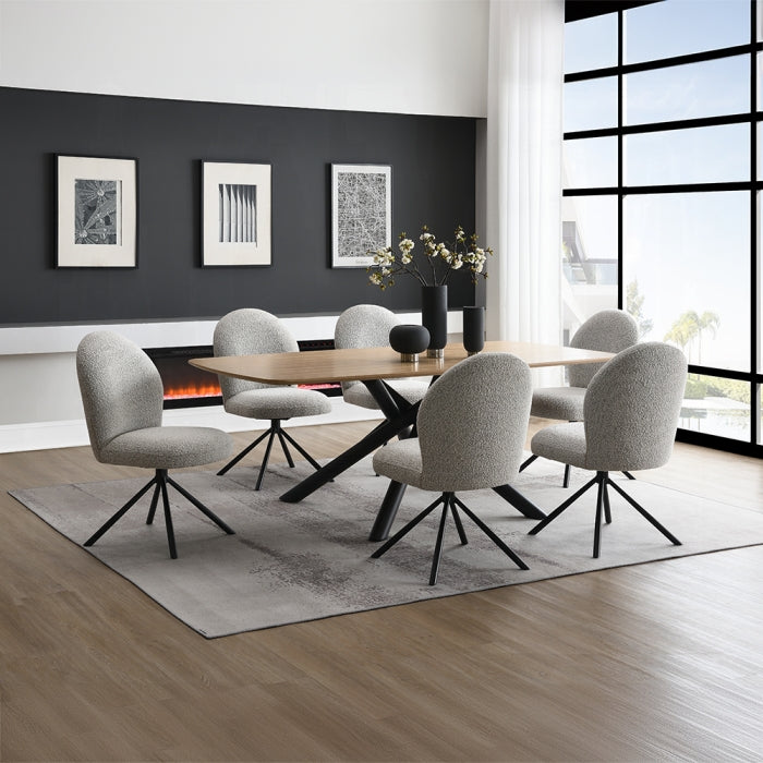 lawton grey boucle chairs staged with a matching lawton table in a dinning room setting indoors with plants vases and rugs 