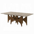 Dining table with wooden base and marble-like top on a white background