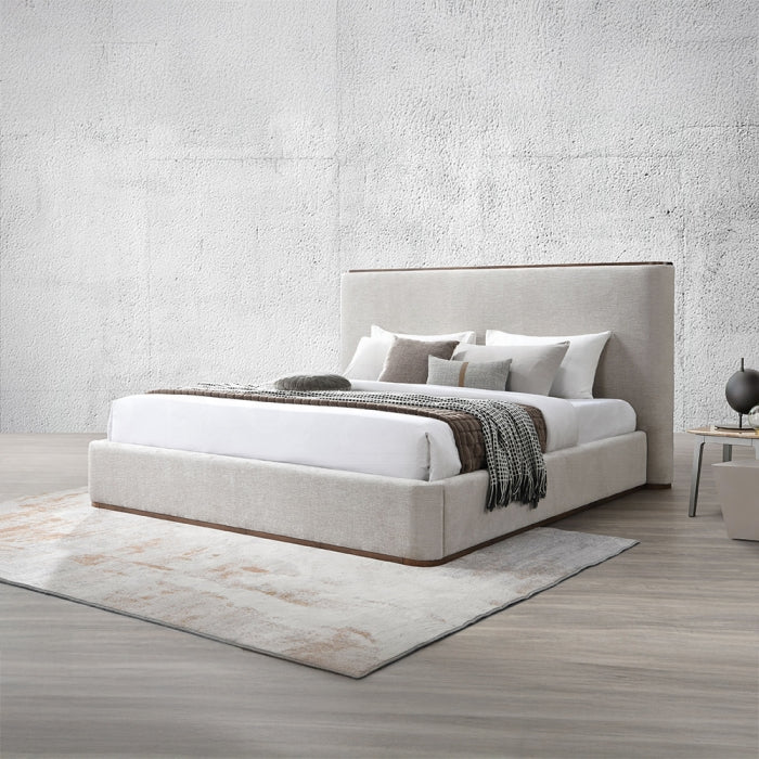orange king bed frame staged in a bedroom setting with pillows blankets rug night stand mostly grey tones 