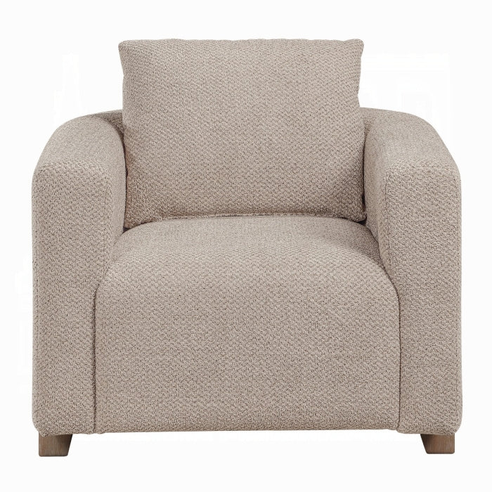 Beige armchair with a textured pattern on a white background