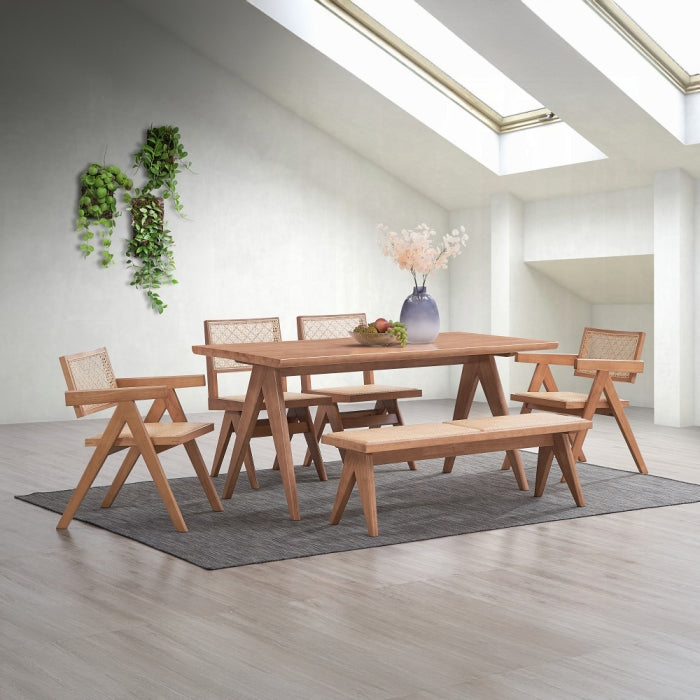 white background lightly curved backrests with pattered breathable rattan net inserts meduim brown wood trangle legs slight patted seating squared arms staged with the velentina table indoors with plants lighting carpet 