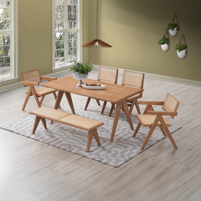 Velentina dinning table staged with chairs that would match it well using the same triangle legs table is in a staged room with carpet plants lights and a window
