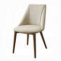 white background chair with 4 wooden legs an a beige color high looking back 