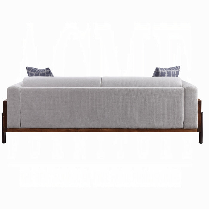 Gray sofa with wooden frame on a white background