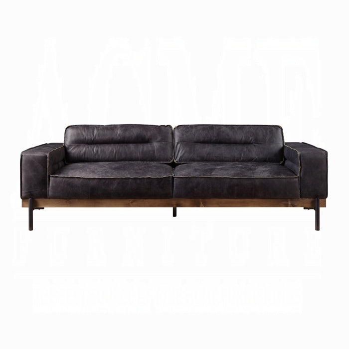 Black leather sofa on a white background