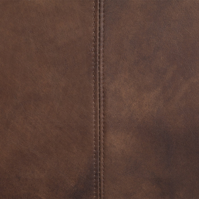 Close-up of brown leather with a visible seam