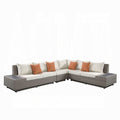Sectional outdoor sofa with wicker frame and orange cushions on a white background