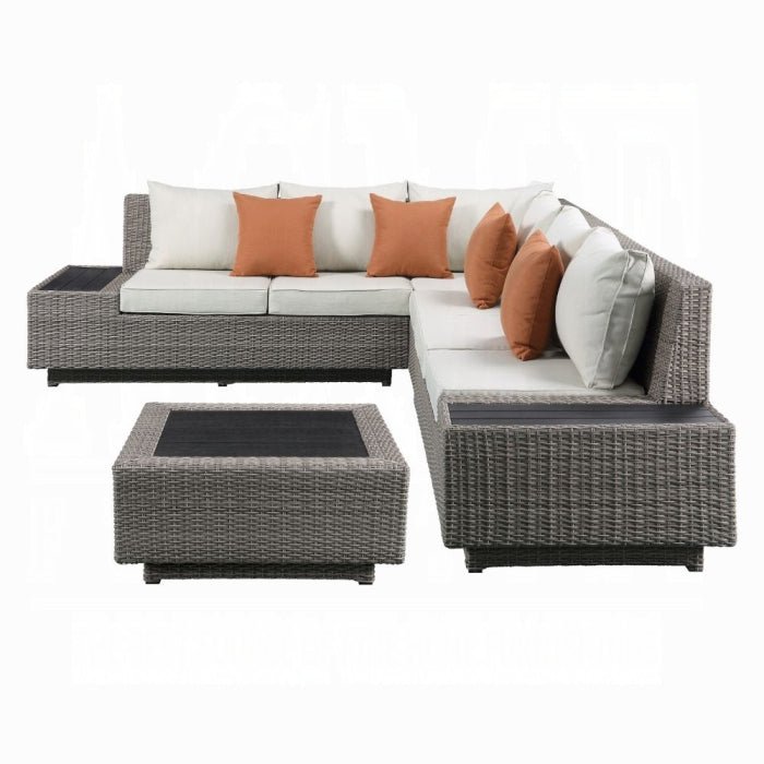 Outdoor furniture set with gray wicker chairs, white cushions, and orange pillows on a white background.