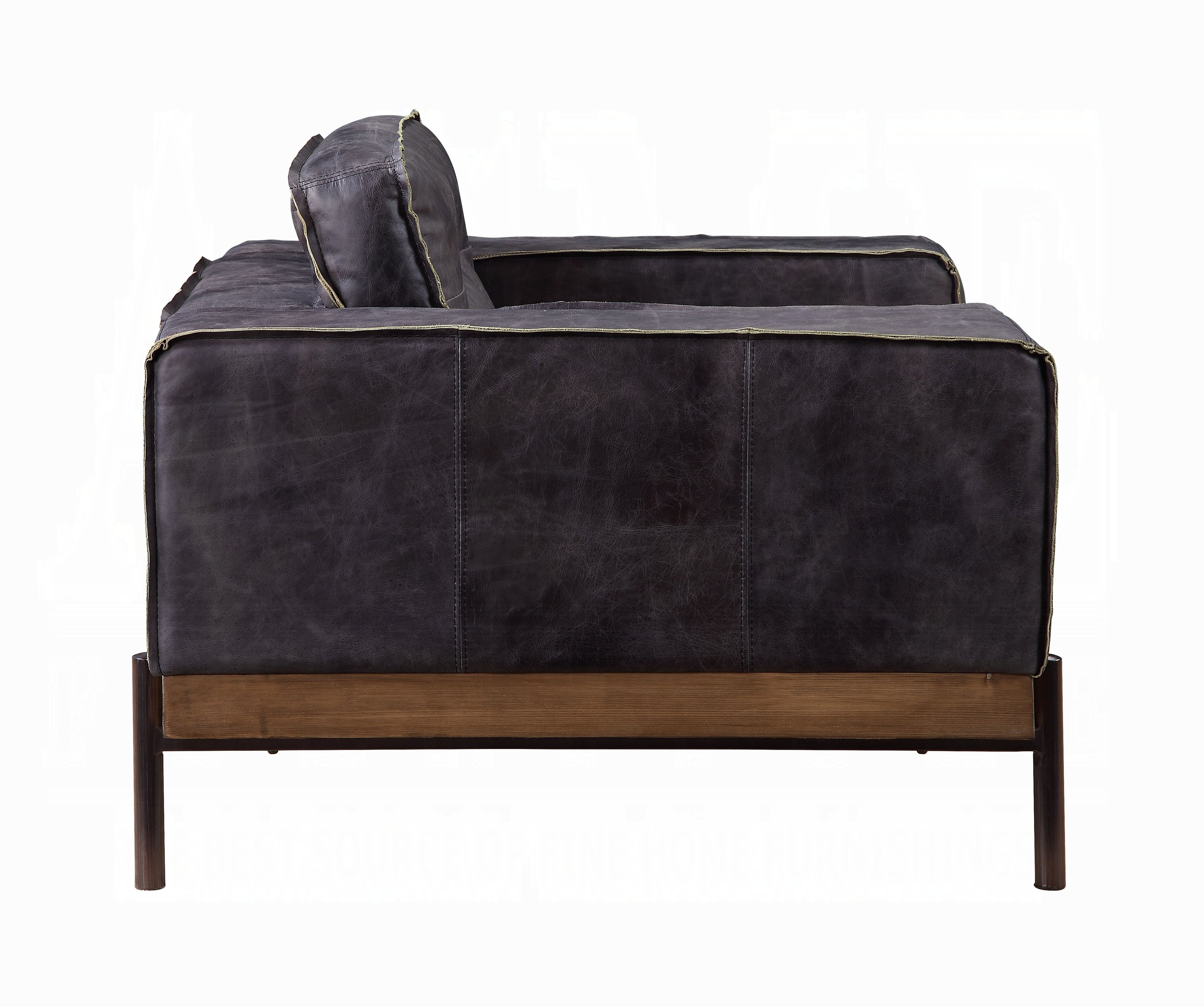 Dark gray leather sofa with wooden base on a white background